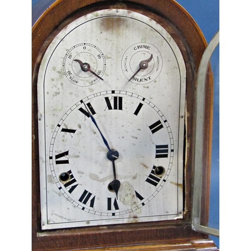 1447 - An Edwardian mahogany bracket clock, the arched silvered dial with chime/silent selector, regulator,... 