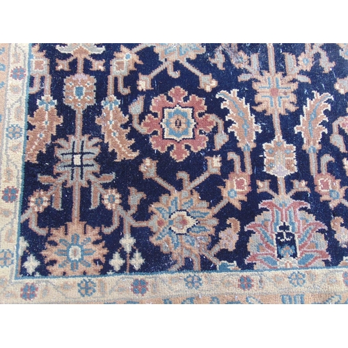 2459 - A Persian design carpet with a large floral pattern on a black ground (as found, moth damage), 235 c... 