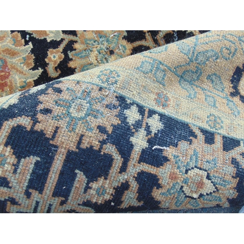 2459 - A Persian design carpet with a large floral pattern on a black ground (as found, moth damage), 235 c... 