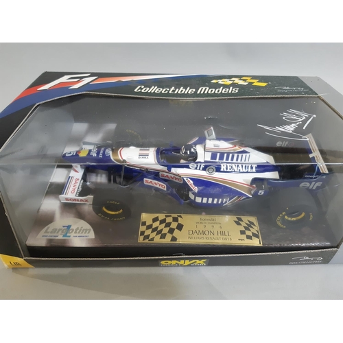 311 - Mixed lot of a boxed Formula 1 racing car by Onyx ref 6007 Williams Renault FW18 Damon Hill, 1:18 sc... 