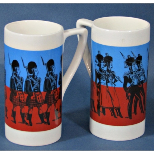 1141 - A pair of Portmeirion pottery mugs, Reddington's New Foot Soldiers in a red and blue colourway