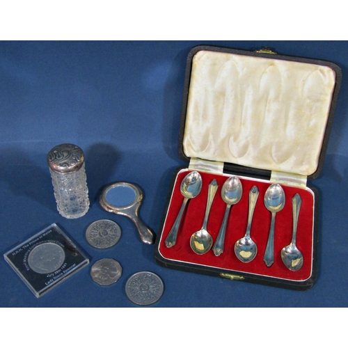 1199 - A cased set of six silver teaspoons, a silver hand mirror and blusher, a silver capped glass bottle,... 