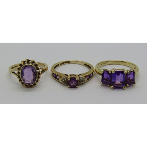 1365 - Three 9ct amethyst rings to include a diamond set example, 7.1g total (3)