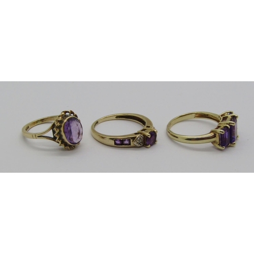 1365 - Three 9ct amethyst rings to include a diamond set example, 7.1g total (3)