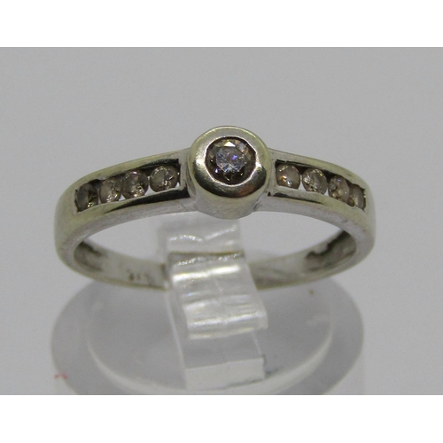 1369 - 9ct white gold diamond ring with channel set diamond shoulders, size K/L, 1.6g