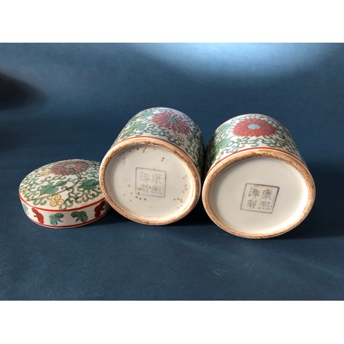 1058 - Pair of Chinese doucai cylindrical boxes with covers, height approx. 16 cm each (2)