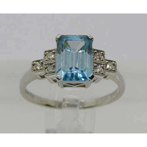 1383 - 950 platinum topaz and diamond ring with stepped shoulders, size N, 4.2g