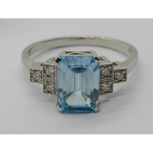 1383 - 950 platinum topaz and diamond ring with stepped shoulders, size N, 4.2g