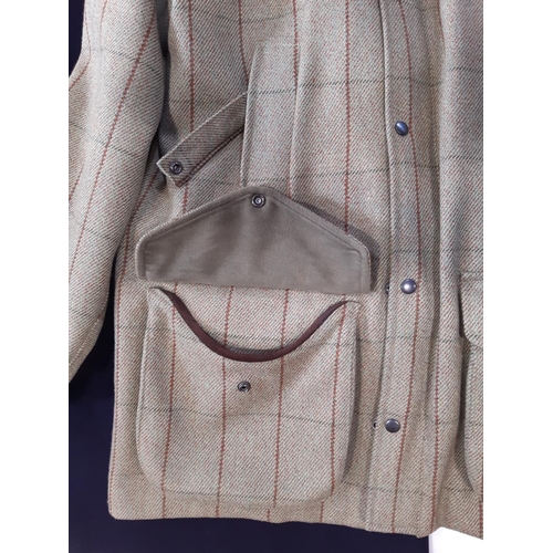 1520 - Men's shooting jacket in woollen tweed with cartridge pockets with retaining straps and moleskin tri... 