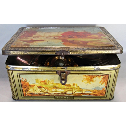 1635 - A Bluebird toffee tin containing brass money box, Victorian brass shoe ornaments, very small copper ... 