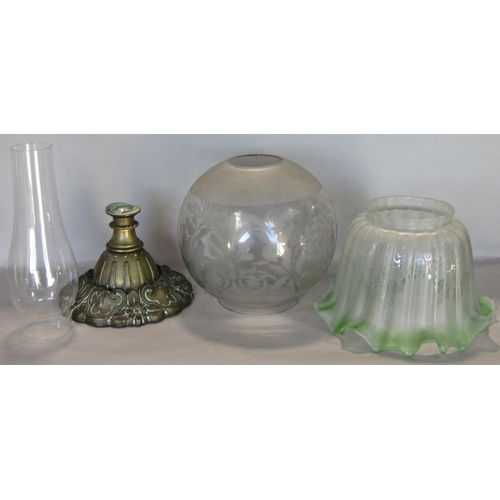 1650 - A Victorian oil lamp with mustard coloured font and cast iron base, together with further oil lamp b... 