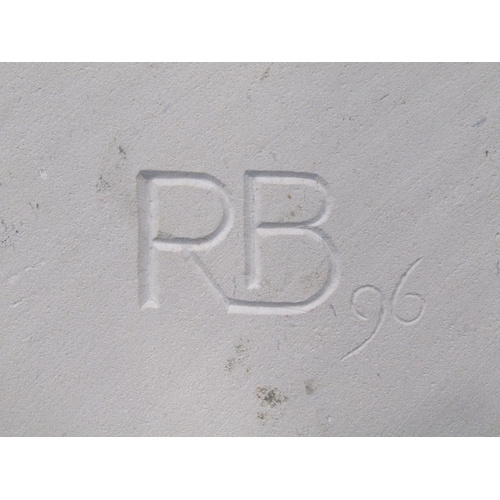 1581 - A limestone carving representing Pieces with two leaping fish, monogrammed RB