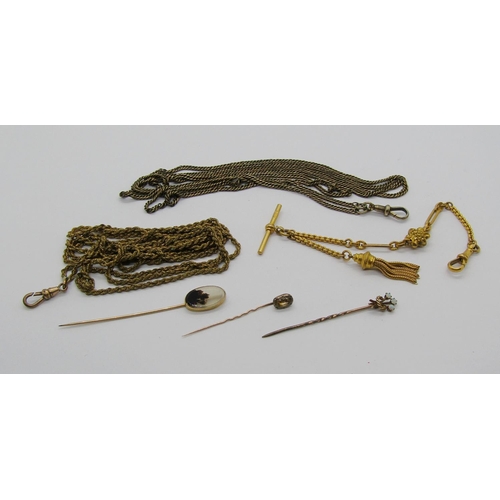 1394 - Three antique yellow metal stick pins to include an example with 15ct head set with three opals, 3.8... 