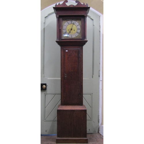 2563 - A Georgian oak country made longcase clock, with column supports enclosing a square brass dial with ... 