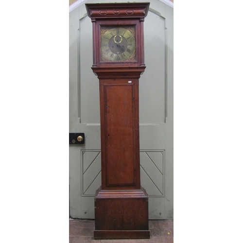 2564 - A Georgian oak longcase clock with column supports enclosing a square brass dial with cast spandrels... 