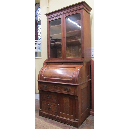 2568 - A small Victorian walnut and figured walnut cylinder top desk, the base enclosed by a single cupboar... 