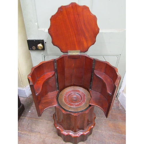 2584 - A good quality Victorian mahogany cylindrical commode with fluted outline, rising lid and opening ar... 