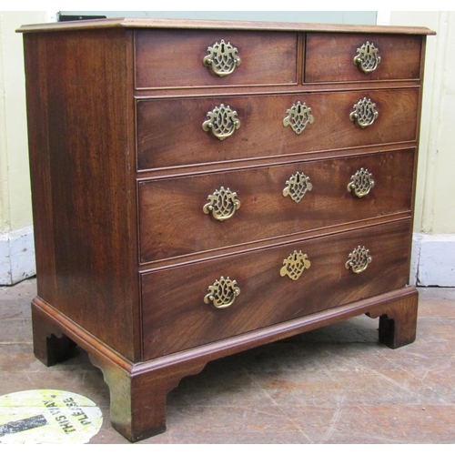 2589 - A small Georgian walnut countrymade chest of three long and two short drawers raised on bracket supp... 