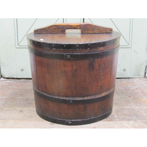 2593 - A Victorian steel banded coopered oak tub and cover, 49cm diameter, 42cm high