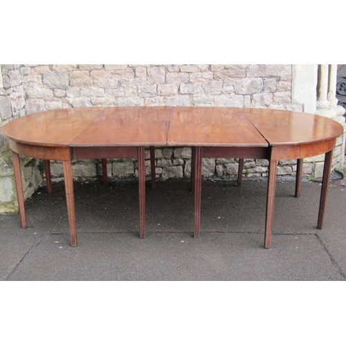 2598 - A Georgian mahogany D end dining table with single additional leaf, D ends supported on tapered legs... 