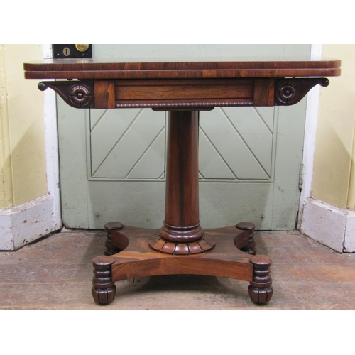 2600 - A Regency foldover top tea table, raised on a cylindrical tapering column and platform base with app... 