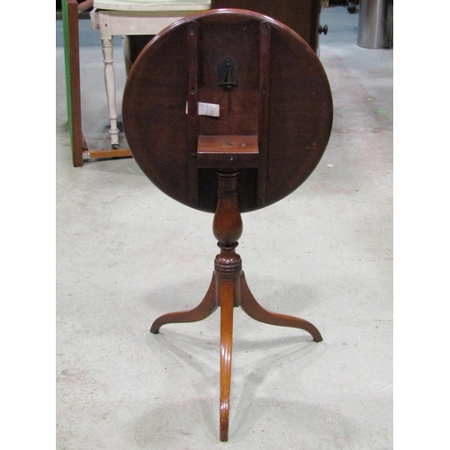 2606 - Georgian snap top table raised on a turned pillar and swept supports, 55cm diameter