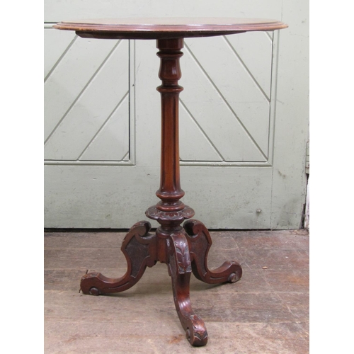 2611 - A Victorian walnut and figured walnut occasional table, the circular top with simple scrolling marqu... 