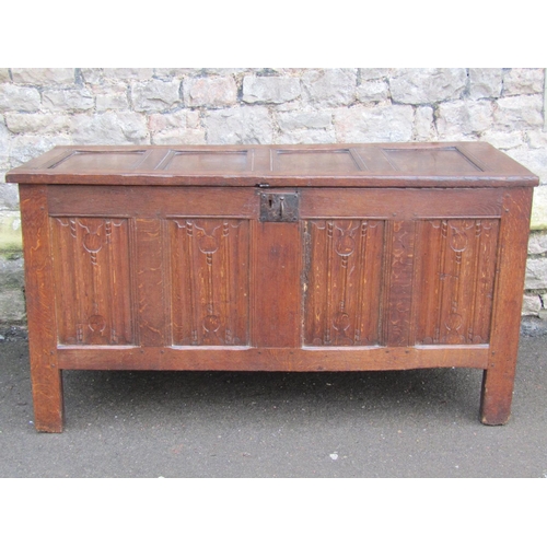 2621 - An early 18th century oak panelled coffer, the front elevation enclosed by four linen fold panels an... 