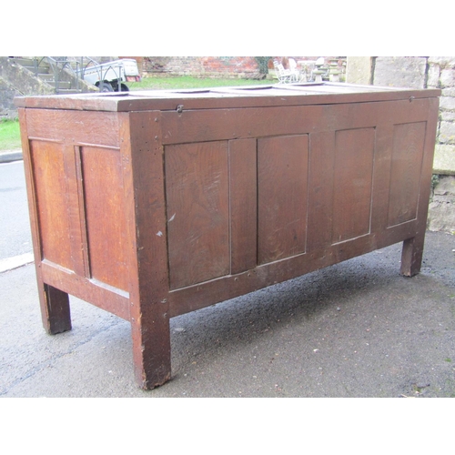 2621 - An early 18th century oak panelled coffer, the front elevation enclosed by four linen fold panels an... 