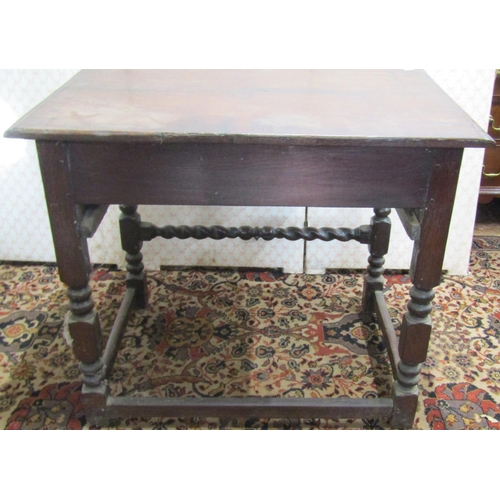 2625 - An antique oak side table with frieze drawer raised on bobbin moulded supports with barley twist rai... 