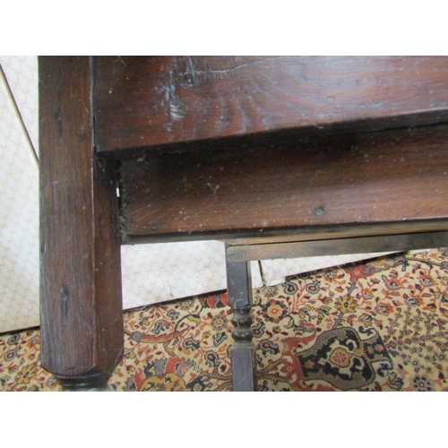 2625 - An antique oak side table with frieze drawer raised on bobbin moulded supports with barley twist rai... 