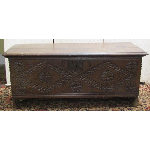 2628 - 18th century oak six plank coffer, with deep geometric carvings, 110cm wide