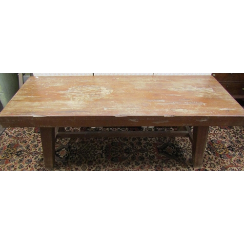 2630 - A heavy hardwood occasional table the rectangular top 9cm deep, raised on four splayed supports unit... 