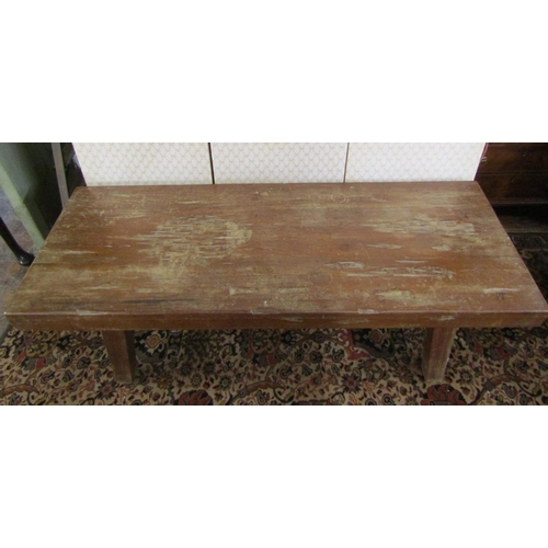 2630 - A heavy hardwood occasional table the rectangular top 9cm deep, raised on four splayed supports unit... 