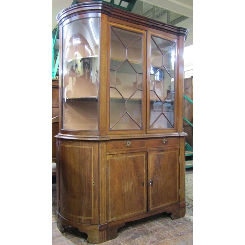 2639 - 19th century inlaid mahogany display cabinet of full height with rounded ends, the lower section wit... 