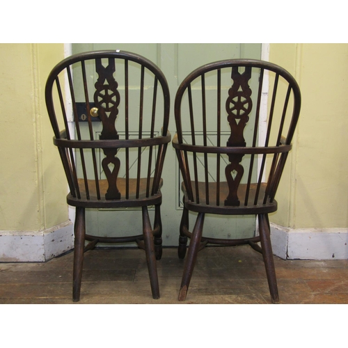 2642 - A set of six (4+2) Windsor wheel back dining chairs principally in ash with elm seats, on turned sup... 