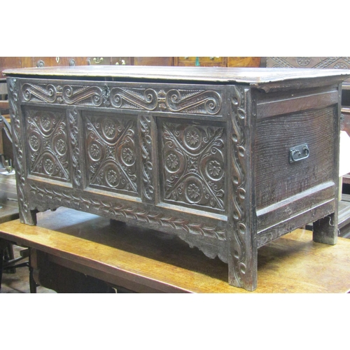 2650 - 18th century oak coffer with panelled frame, the front with repeating geometric detail, 132cm wide