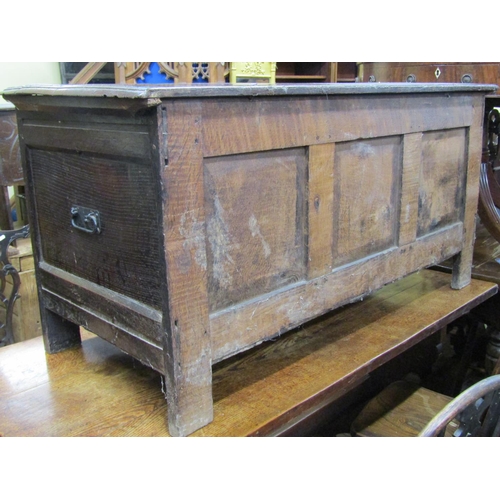 2650 - 18th century oak coffer with panelled frame, the front with repeating geometric detail, 132cm wide