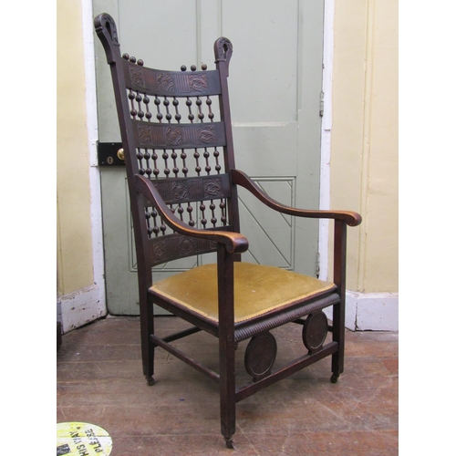 2654 - An arts and crafts bobbin and bar back elbow chair in birch and elm, with embossed leather panels wi... 