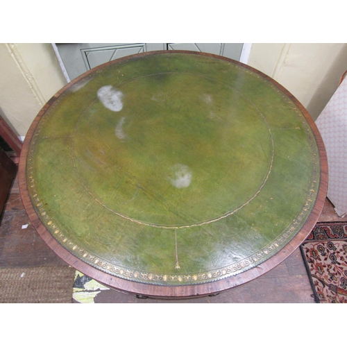 2655 - A Georgian mahogany drum table, the circular top inset with embossed green leather enclosing a serie... 