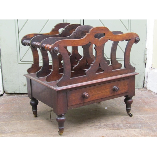 2656 - A Regency rosewood four divisional Canterbury with shaped and pierced outline, over a frieze drawer ... 