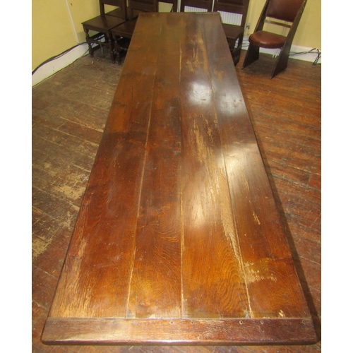 2657 - A good quality old English style oak refectory table to seat ten, the heavy plank top with cleated e... 