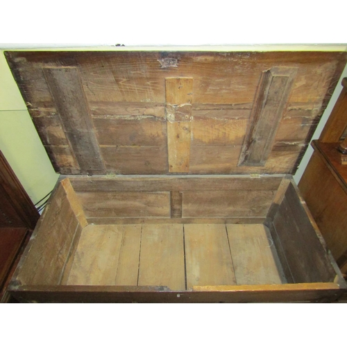 2662 - 18th century oak panelled coffer with fielded panels to front and sides beneath a plank top, 130cm w... 