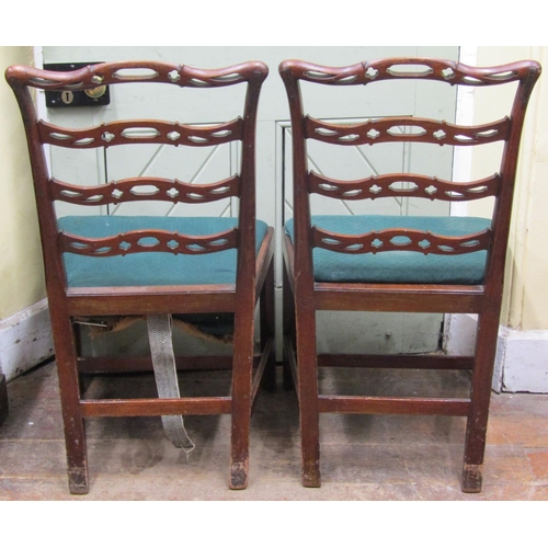 2667 - A pair of Georgian mahogany ladderback dining chairs, the rails with carved and pierced detail with ... 