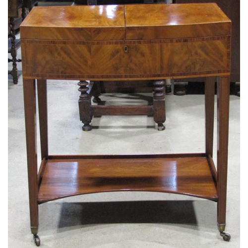 2676 - A Georgian mahogany foldover top dressing table of bowfronted outline, set on four square tapered le... 