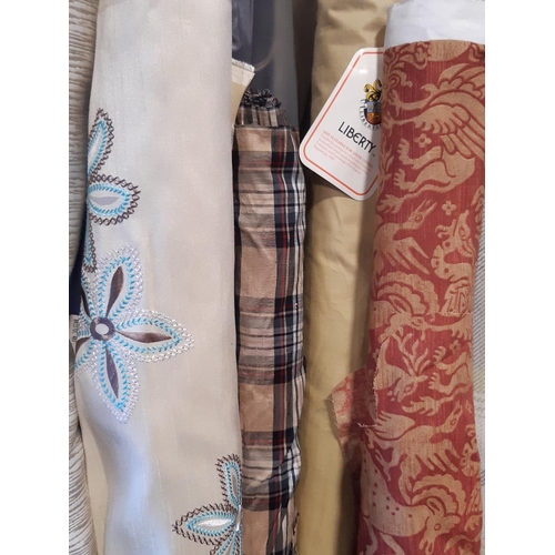1512 - Large quantity of good quality part rolls of  dress and upholstery fabrics, and linings including a ... 