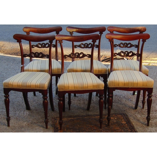 2515 - A set of six Regency mahogany dining chairs raised on turned and fluted supports with upholstered se... 