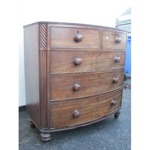 2517A - An early 19th century mahogany bow fronted chest of three long and two short drawers with reeded cor... 