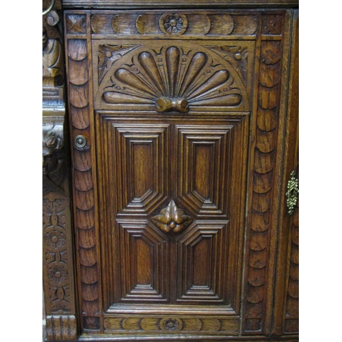 2520 - A 19th century oak pier cabinet, the lower section enclosed by a pair of quarter panelled doors, ope... 