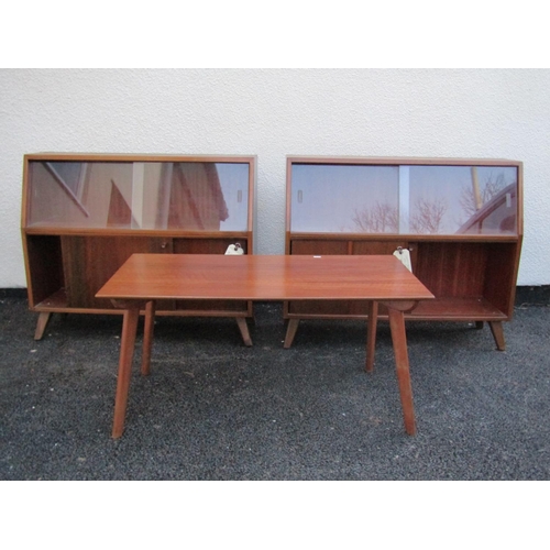 2552 - A pair of mid 1950s Greaves Thomas bookcases, the lower section enclosed by sliding timber doors, th... 